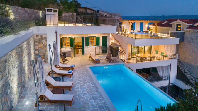 Enjoying the infinity pool, Villa Mladenka with Heated Infinity Pool, Dalmatia, Croatia Jesenice